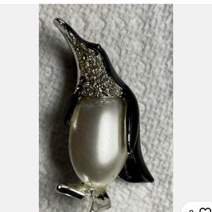 Black enamel and rhinestone penguin brooch with a large faux pearl belly
